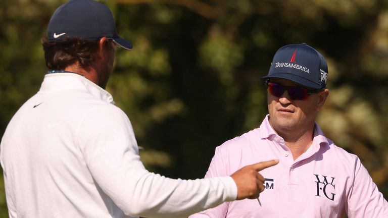 CORRECTS FIRST NAME TO ZACH, NOT ZAC AS ORIGINALLY SENT - United States' Zach Johnson, right, speaks to United States' Brooks Koepka during a practice round for the British Open Golf Championships at the Royal Liverpool Golf Club in Hoylake, England, Monday, July 17, 2023. The Open starts Thursday, July 20. (AP Photo/Peter Morrison)