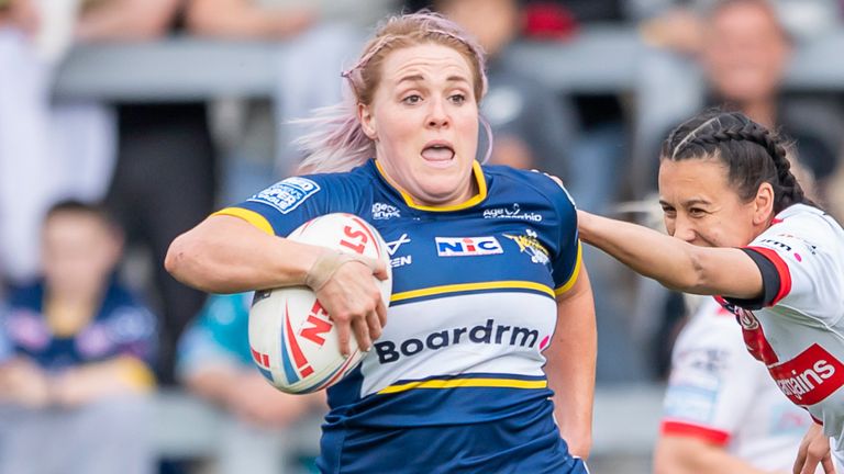 Picture by Allan McKenzie/SWpix.com - 26/05/2023 - Rugby League - Betfred Women's Super League - Leeds Rhinos v St Helens - Headingley Stadium, Leeds, England - Leeds's Amy Hardcastle evades the tackle of St Helens's Zoe Harris.