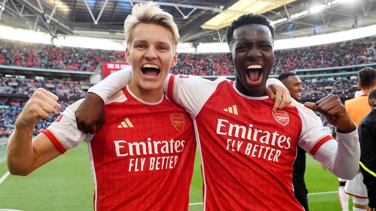 Martin Odegaard and Edward Nketiah celebrate Arsenal's victory in the Community Shield
