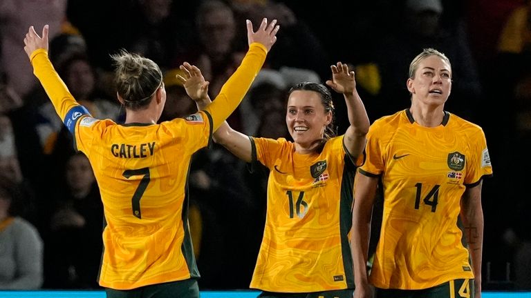 Australia players celebrate the second goal of their team during the Women's World Cup round of 16 soccer match between Australia and Denmark at Stadium Australia in Sydney, Australia, Monday, Aug. 7, 2023. (AP Photo/Mark Baker)