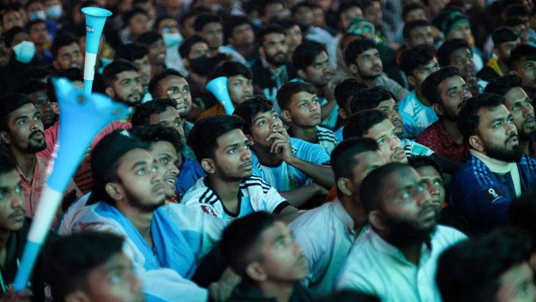 Bangladeshi soccer fans watch on a big screen in Dhaka, Bangladesh, the World Cup semi final soccer match between Argentina and Croatia in Qatar, Wednesday, Dec. 14, 2022. Argentina defeated Croatia 3-0. (AP Photo/Mahmud Hossain Opu)