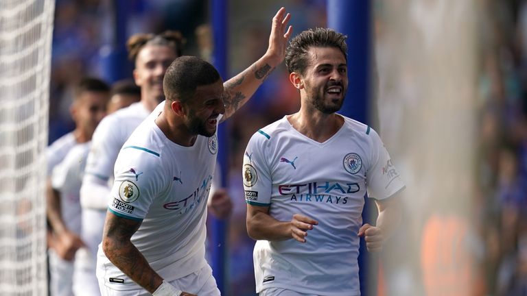 Manchester City&#39;s Bernardo Silva (right) celebrates with team-mate Kyle Walker after scoring their side&#39;s first goal of the game during the Premier League match at The King Power Stadium, Leicester. Picture date: Saturday September 11, 2021.
