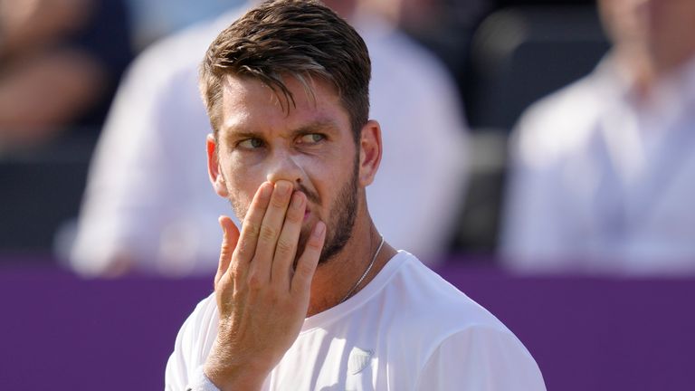Cameron Norrie of Britain reacts after he plays a return to Sebastian Korda of the USA during their quarterfinal singles tennis match at the Queen's Club tournament in London, Friday, June 23, 2023. (AP Photo/Kirsty Wigglesworth)