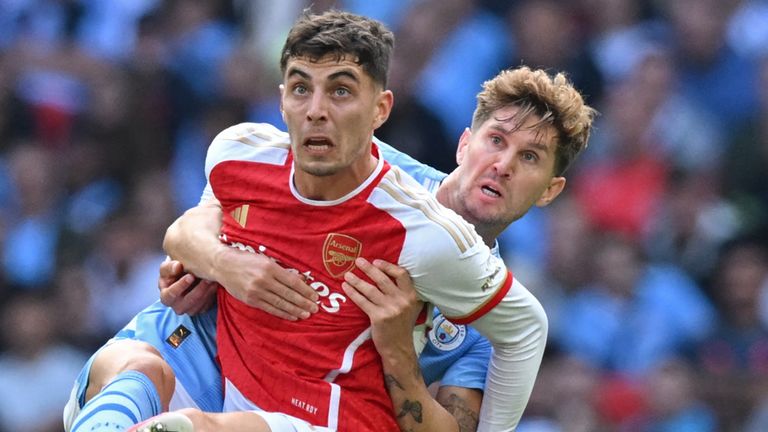 Kai Havertz tussles with John Stones