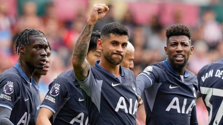 Tottenham's Cristian Romero celebrates with team-mates after scoring the opening goal