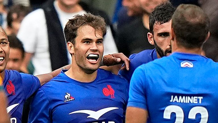 France's Damian Penaud celebrates with team-mates