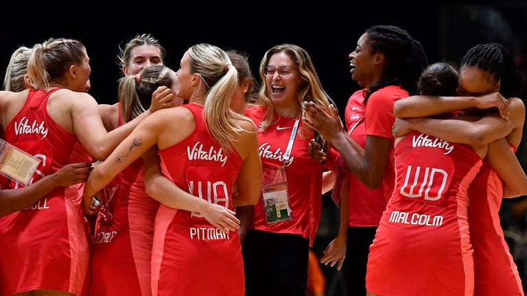 England players celebrate reaching the Netball World Cup final