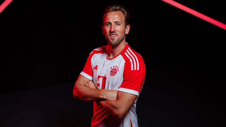 Harry Kane poses for photographs after signing for Bayern Munich