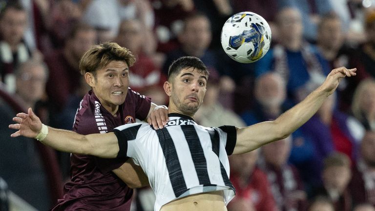 EDINBURGH, SCOTLAND - AUGUST 24: Hearts' Kyosuke Tagawa and PAOK's Konstantinos Koulierakis during a UEFA Conference League Play-Off Round match between Hearts and PAOK at Tynecastle Stadium, on August 24, 2023, in Edinburgh, Scotland. (Photo by Mark Scates / SNS Group)