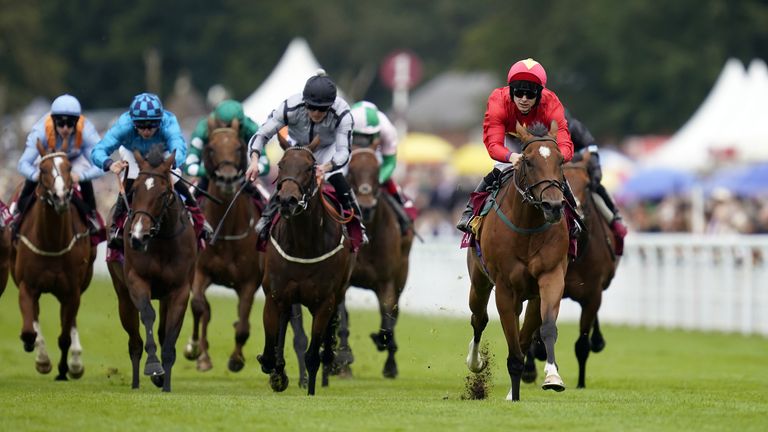 Highfield Princess (right) goes well away from the field to win at Goodwood