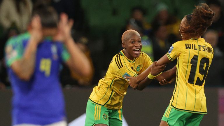 Jamaica's Deneisha Blackwood, center, celebrates with her teammate Jamaica's Tiernny Wiltshire, after the Women's World Cup Group F soccer match between Jamaica and Brazil in Melbourne, Australia, Wednesday, Aug. 2, 2023. (AP Photo/Hamish Blair)