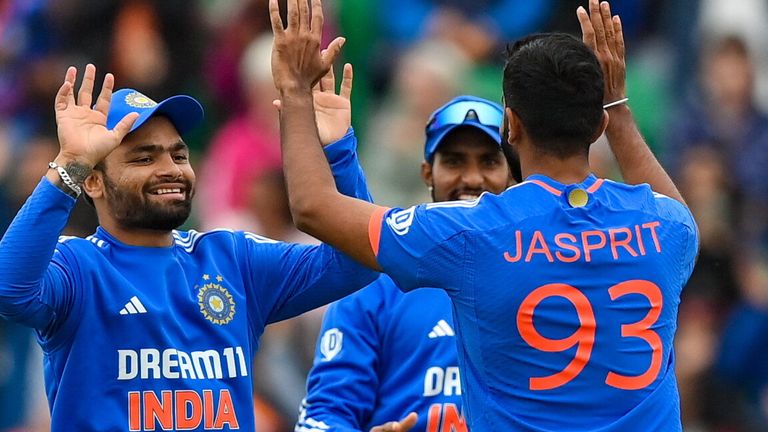 Dublin , Ireland - 18 August 2023; Jasprit Bumrah of India, 93, celebrates with teammate Rinku Singh after taking the wicket of Ireland's Andrew Balbirnie during match one of the Men's T20 International series between Ireland and India at Malahide Cricket Ground in Dublin. (Photo By Seb Daly/Sportsfile via Getty Images) 