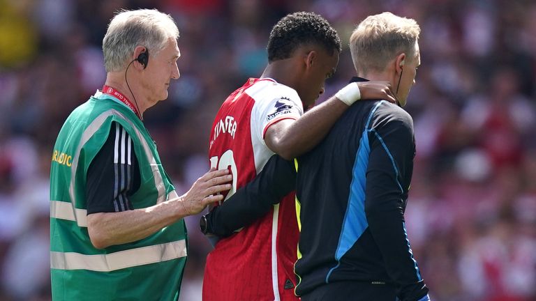 Arsenal&#39;s Jurrien Timber leaves the pitch after picking up an injury