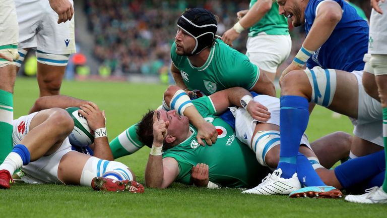 Dave Kilcoyne celebrates his try for Ireland with Doris having latched onto his shoulder