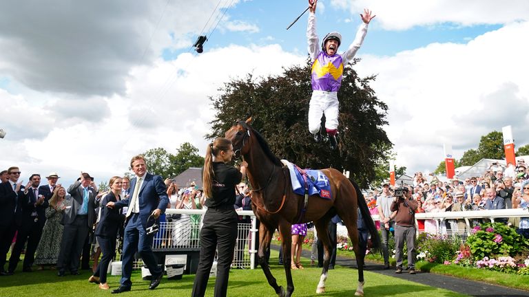 Frankie Dettori with a flying dismount after victory on Kinross at York