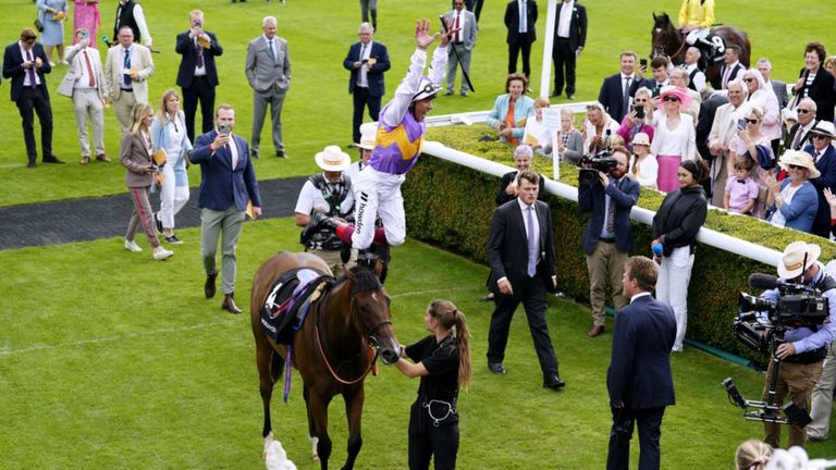 Frankie Dettori performs his famous flying dismount celebration