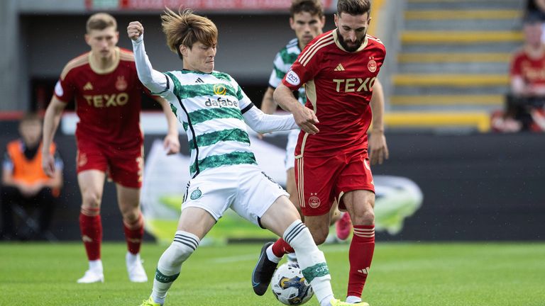 Celtic's Kyogo Furuhashi and Aberdeen's Graeme Shinnie in action