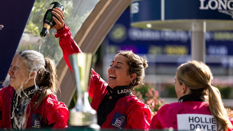 Ladies captain pours champagne on teammate Saffie Osborne after celebrating Shergar Cup victory at Ascot