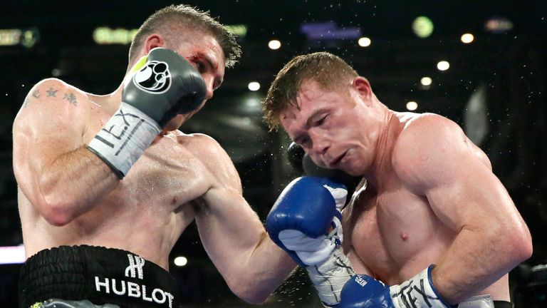 Canelo Alvarez, right, and Liam Smith fight during the WBO Junior Middleweight Championship boxing match at the stadium in Arlington, Texas, Saturday, Sept. 17, 2016. (AP Photo/LM Otero)             
