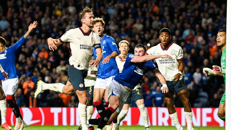 GLASGOW, SCOTLAND - AUGUST 22: Rangers' John Souttar goes down in the box after contact from PSV's Luuk de Jong during a UEFA Champions League play-off round first leg match between Rangers and PSV Eindhoven at Ibrox Stadium, August 22, 2023, in Glasgow, Scotland. (Photo by Rob Casey / SNS Group)