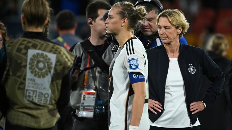 Germany manager Martina Voss-Tecklenburg reacts to the defeat to South Korea with Alexandra Popp