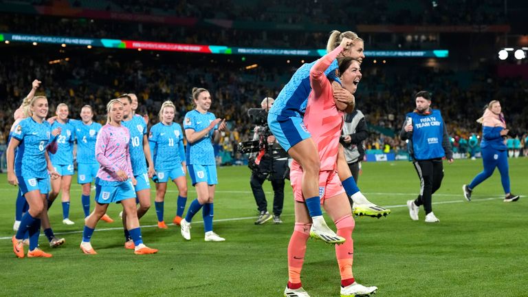 England's goalkeeper Mary Earps and England's Rachel Daly celebrate after winning their Women's World Cup semi-final tie against Australia