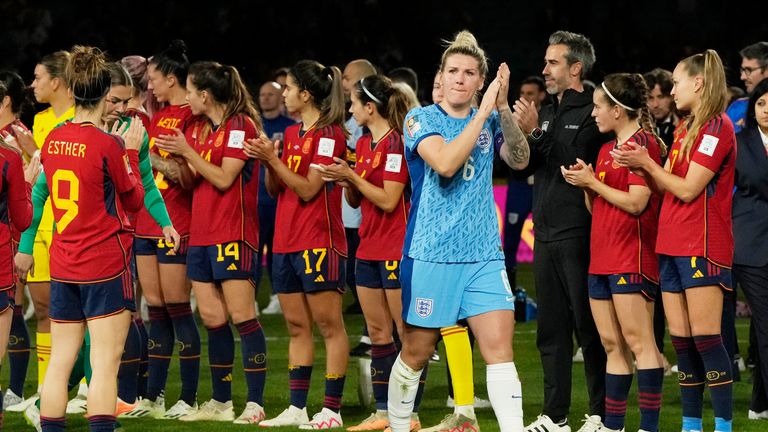 England's Millie Bright applauds while walking past Spain's players after the final of Women's World Cup soccer between Spain and England at Stadium Australia in Sydney, Australia, Sunday, Aug. 20, 2023. (AP Photo/Rick Rycroft)