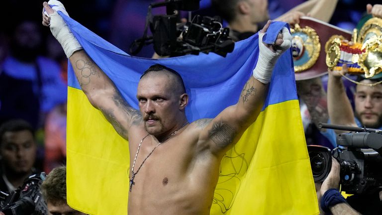 FILE - Ukraine's Oleksandr Usyk celebrates after beating Britain's Anthony Joshua to retain his world heavyweight title at King Abdullah Sports City in Jeddah, Saudi Arabia, Sunday, Aug. 21, 2022. Heavyweight champion Oleksandr Usyk is set to defend his WBA, WBO and IBF belts against Daniel Dubois this August in Poland, where the Ukrainian fighter will have plenty of home support. Usyk announced Thursday, July 6, 2023, that he...ll face Dubois, a Briton who is the WBA mandatory challenger, on Aug. 26 at Tarczynski Arena. (AP Photo/Hassan Ammar, File)