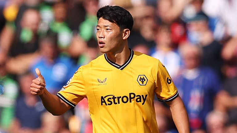 Hee-Chan Hwang gives a thumbs-up to his Wolves team-mates after scoring against Brighton