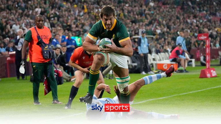 South Africa&#39;s Eben Etzebeth, front, scores a try as he leaps over Argentina&#39;s Santiago Carreras during the Rugby Championship test match between South Africa and Argentina at Ellis Park stadium in Johannesburg , South Africa, Saturday, July 29, 2023. (AP Photo/Themba Hadebe)


