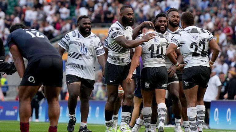 Fiji&#39;s players celebrate their win over England, forcing Steve Borthwick&#39;s side down to eighth position in the world rankings