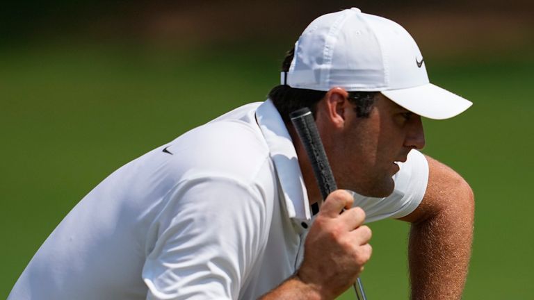 Scottie Scheffler lines up a putt on the seventh green during the second round of the Tour Championship golf tournament, Friday, Aug. 25, 2023, in Atlanta. (AP Photo/Mike Stewart)