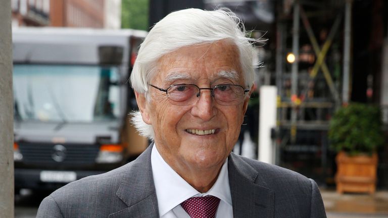 FILE - British broadcaster, journalist and author Michael Parkinson poses for photographers as he arrives for the memorial of broadcaster Alan Whicker, in central London, Wednesday, May 28, 2014. Michael Parkinson, the renowned British broadcaster who interviewed everyone from Muhammed Ali, David Bowie and Miss Piggy, has died. He was 88. In a statement Thursday, Aug. 17, 2023 to the BBC, his family said Parkinson died ...peacefully at home last night in the company of his family." (AP Photo/Lefteris Pitarakis, file)