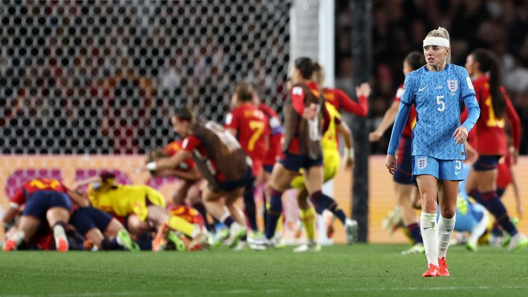 Spain celebrate winning the Women's World Cup final as England's Alex Greenwood leaves the field