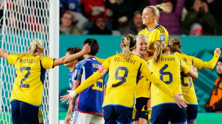 Sweden players celebrate after Amanda Ilestedt scored the opening goal during the Women&#39;s World Cup quarterfinal soccer match between Japan and Sweden at Eden Park in Auckland, New Zealand, Friday, Aug. 11, 2023. (AP Photo/Abbie Parr)