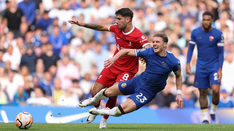 Liverpool's Dominik Szoboszlai, left, challenges for the ball with Chelsea's Conor Gallagher during the English Premier League soccer match between Chelsea and Liverpool at Stamford Bridge Stadium in London on Sunday, August 13, 2023. (AP Photo/Ian Walton)