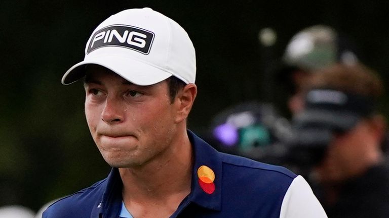 Viktor Hovland, of Norway, reacts to his putt on the first green during the third round of the Tour Championship golf tournament, Sunday, Aug. 27, 2023, in Atlanta. (AP Photo/Mike Stewart)