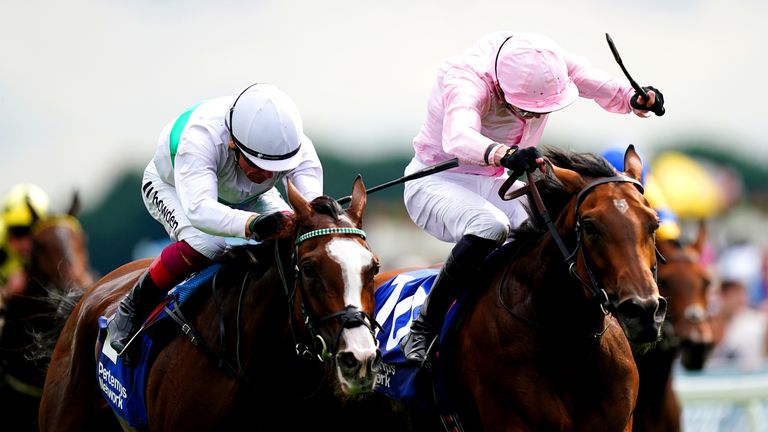 James Doyle is all action on Warm Heart (right) to beat Frankie Dettori on Free Wind