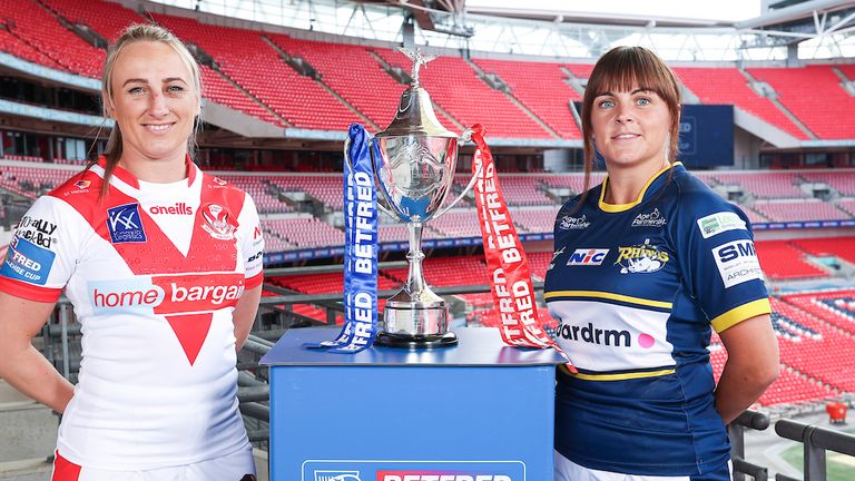 Picture by Kieran Cleeves/SWpix.com - 26/07/2023 - Rugby League - Betfred Women's Challenge Cup Preview - Leeds Rhinos v St Helens - Wembley Stadium, London, England - St Helens's Jodie Cunningham with Leeds's Hanna Butcher and Women's Challenge Cup trophy at Wembley.