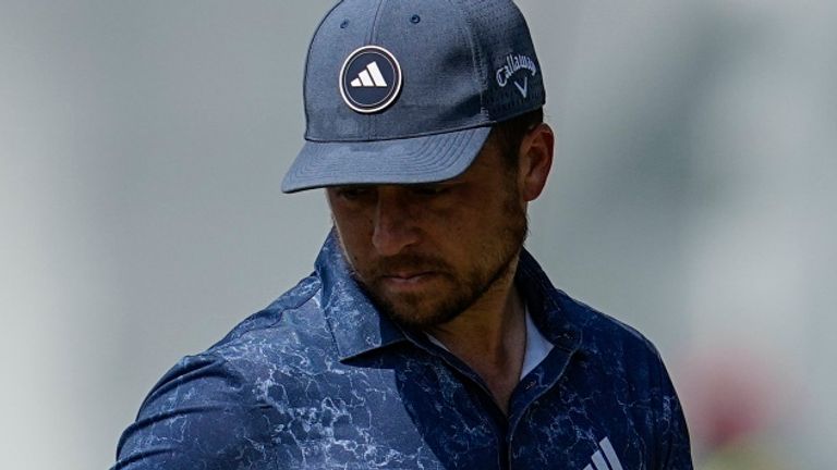 Xander Schauffele lines up a putt on the fifth green during the third round of the Tour Championship golf tournament, Saturday, Aug. 26, 2023, in Atlanta. (AP Photo/Mike Stewart)