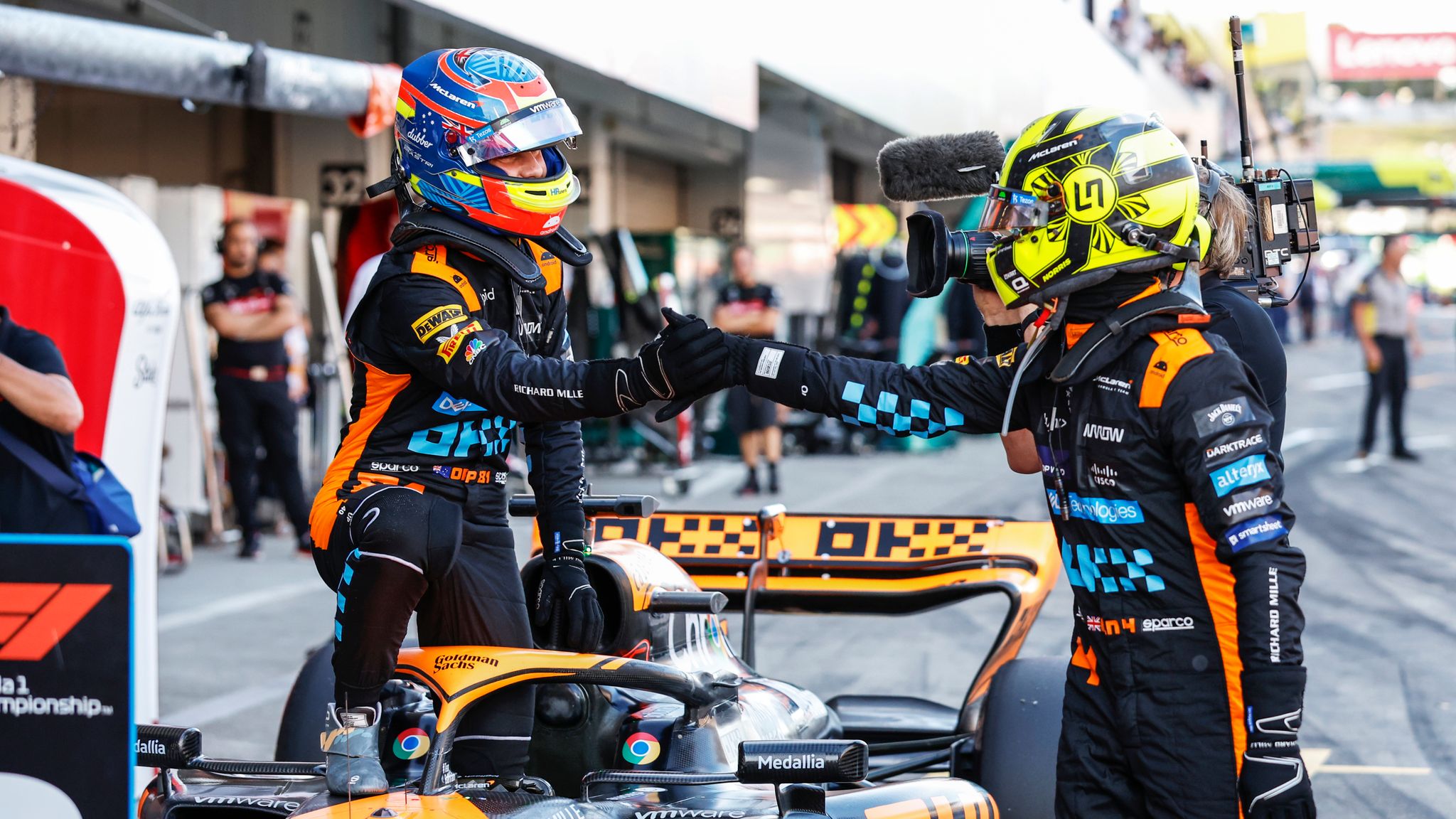 McLaren drivers Lando Norris and Oscar Piastri celebrate their double podium finish together.