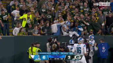 St. Brown scores opening touchdown and does Lambeau Leap!