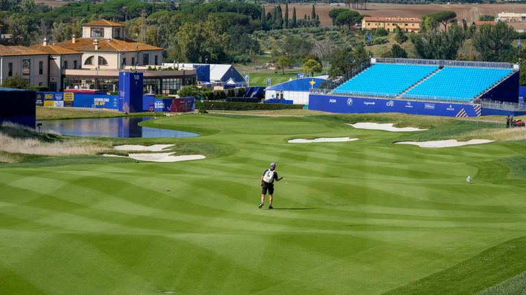 A workers tests the fairway of the 18th hole of the course of the Marco Simone Golf Club in Guidonia Montecelio, Monday, Sept. 25, 2023. The Marco Simone Club on the outskirts of Rome will host the 44th edition of The Ryder Cup, the biennial competition between Europe and the United States headed to Italy for the first time. (AP Photo/Andrew Medichini)