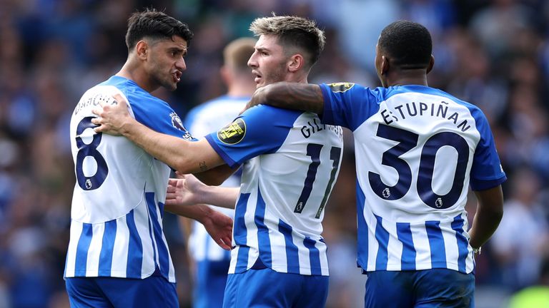 Brighton's Mahmoud Dahoud, Billy Gilmour and Pervis Estupinan celebrate their side's first goal of the game, an own goal scored by Bournemouth's Milos Kerkez (not pictured)