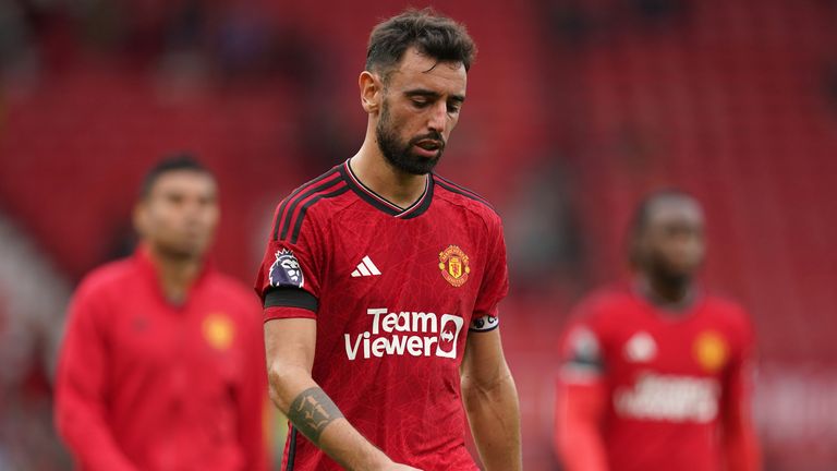 Bruno Fernandes walks off dejected after the 3-1 loss to Brighton