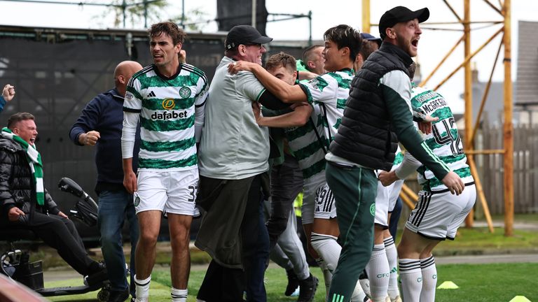 Fans spill onto the pitch after O'Riley's late winner