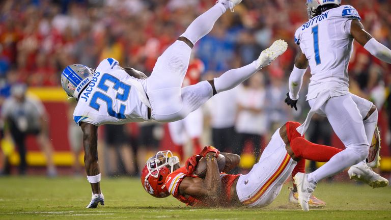 Kansas City Chiefs wide receiver Marquez Valdes-Scantling, bottom, makes a first-down catch late in the second quarter as Detroit Lions cornerback Jerry Jacobs (23) flies over him during the first half of an NFL football game, Thursday, Sept. 7, 2023 in Kansas City, Mo.