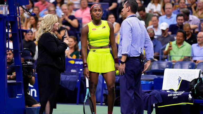 Coco Gauff, of the United States, talks with USTA officials during a disruption in play against Karolina Muchova, of the Czech Republic, during the women's singles semifinals of the U.S. Open tennis championships, Thursday, Sept. 7, 2023, in New York. (AP Photo/Manu Fernandez)