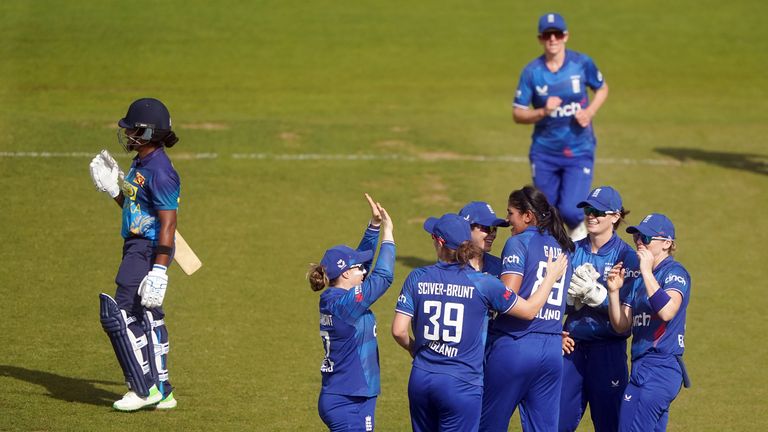 England pacer Mahika Gaur celebrates with her teammates after taking the wicket of Sri Lanka's Chamari Athapathu during the first one-day international at Chester-le-Street. 