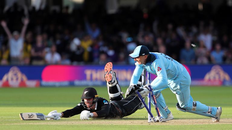 England's Jos Buttler runs out New Zealand's Martin Guptill during the Super Over to win the Cricket World Cup final match